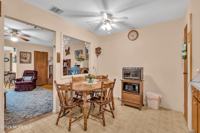 dining room featuring ceiling fan