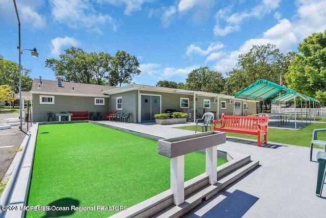 view of community with a patio