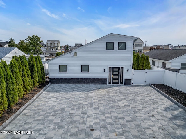 back of house featuring central AC unit and a patio