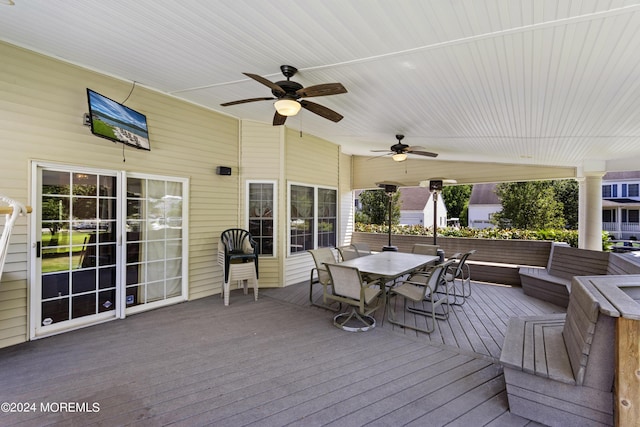 deck with an outdoor living space and ceiling fan