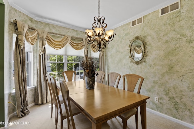 dining area featuring carpet, ornamental molding, and a notable chandelier