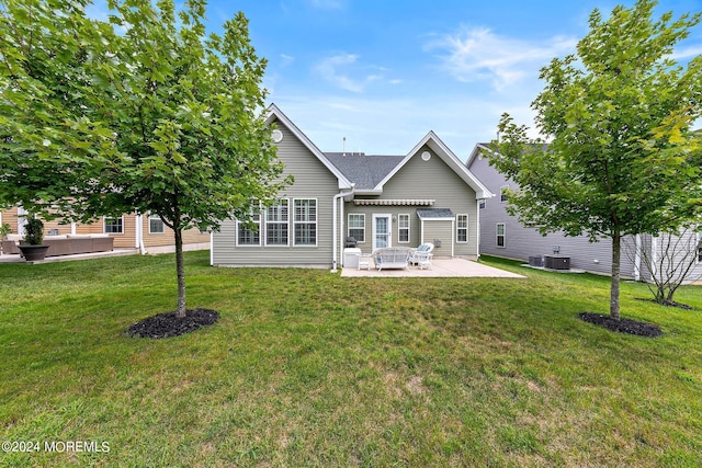 back of house with a patio, central AC unit, and a yard