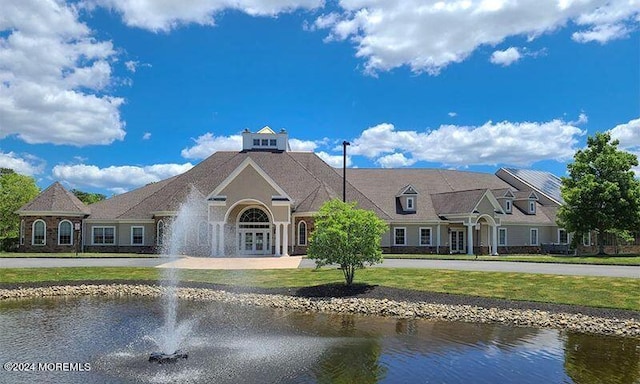 rear view of house with a water view