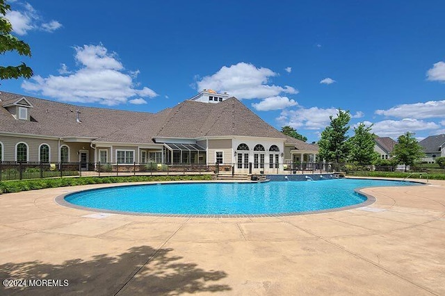 view of swimming pool with a patio area