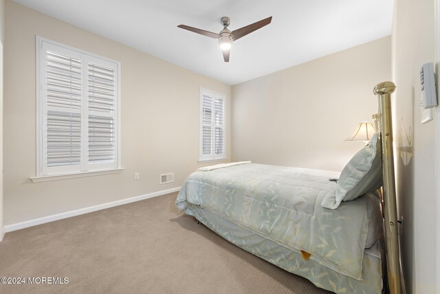 bedroom with carpet floors and ceiling fan