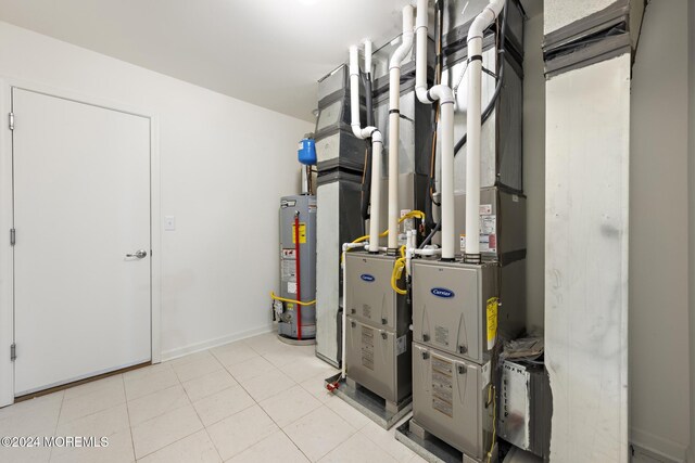 utility room featuring gas water heater