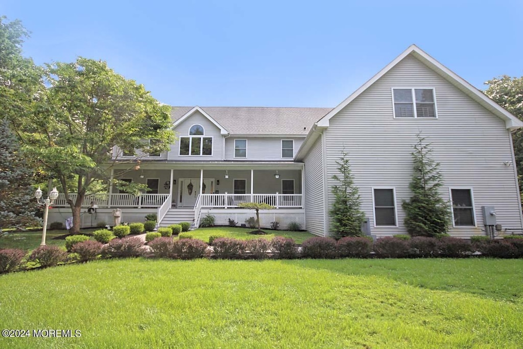 view of front of home featuring a porch and a front lawn