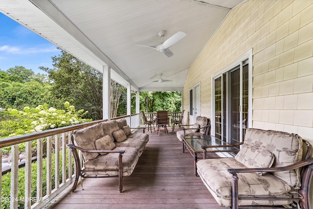 wooden terrace featuring ceiling fan