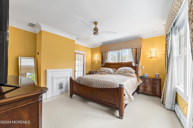 carpeted bedroom featuring ornamental molding, a baseboard radiator, and ceiling fan