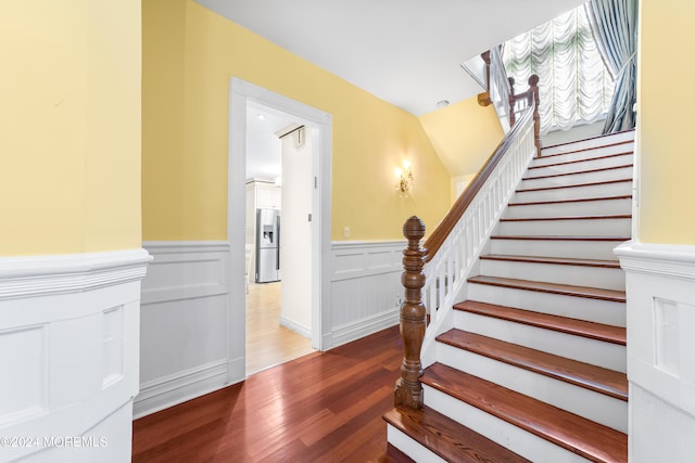 staircase featuring hardwood / wood-style floors