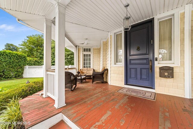 view of exterior entry with a porch