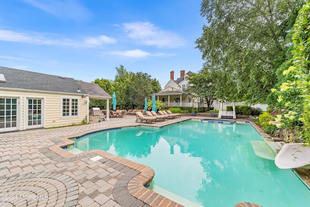 view of pool featuring a patio area