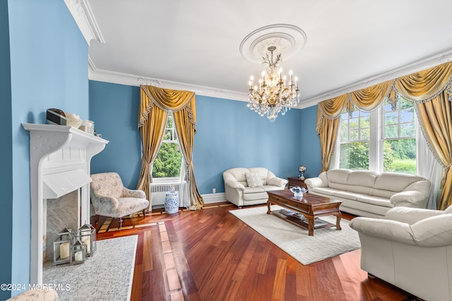 living room featuring crown molding, a notable chandelier, dark wood-type flooring, and a wealth of natural light