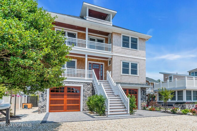 view of front of home with a garage and covered porch