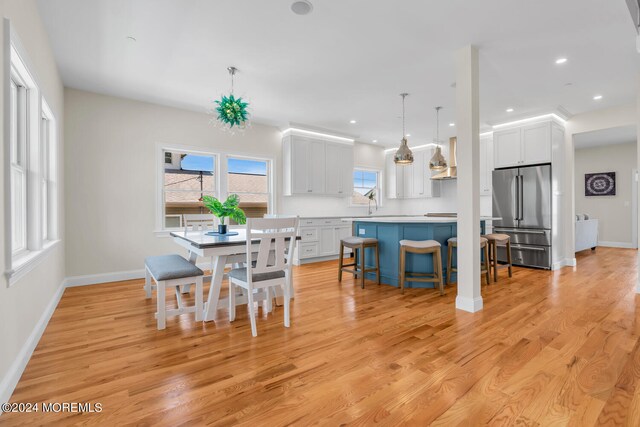 dining area with light wood-type flooring