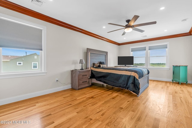 bedroom featuring ornamental molding, ceiling fan, and light hardwood / wood-style floors