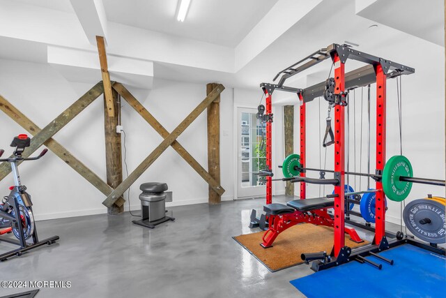 workout room featuring concrete floors