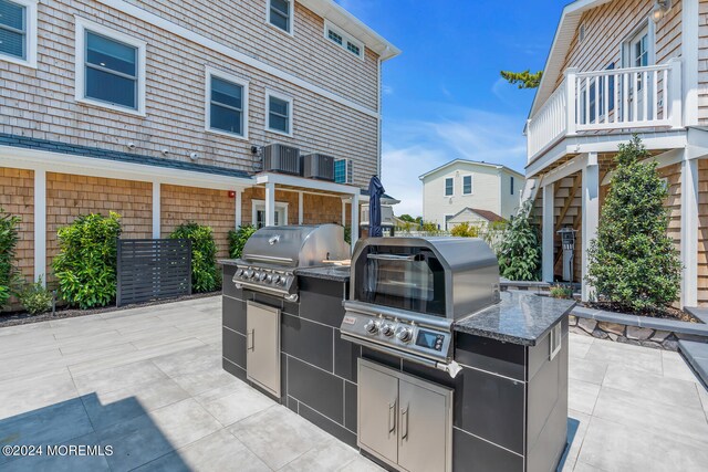 view of patio / terrace featuring a balcony and area for grilling