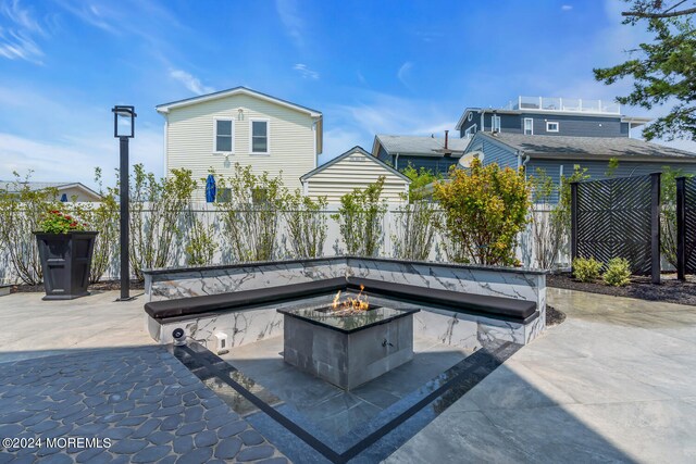 view of patio featuring an outdoor fire pit