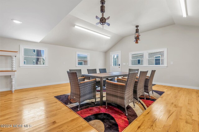 dining area featuring ceiling fan, light hardwood / wood-style flooring, and lofted ceiling