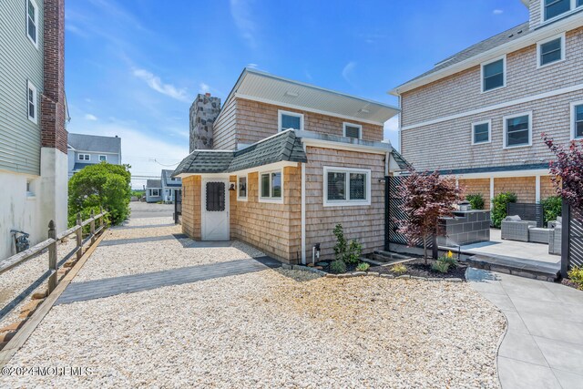 back of house with a patio area