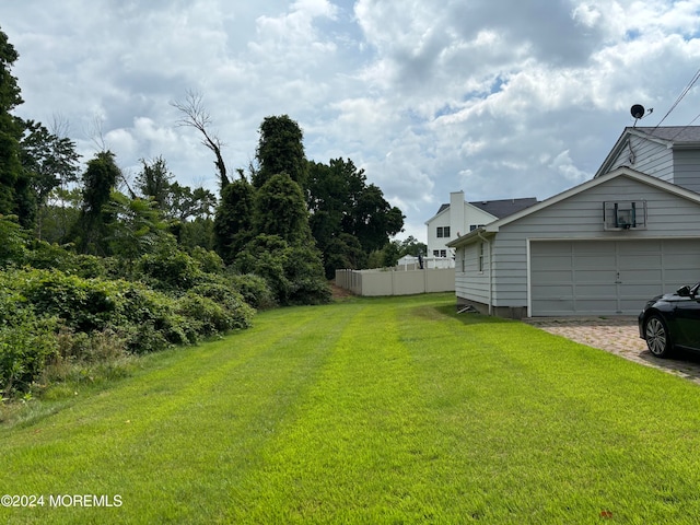 view of yard featuring a garage