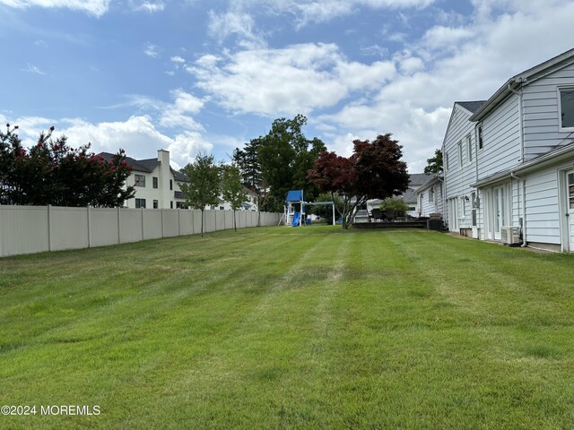 view of yard featuring central AC