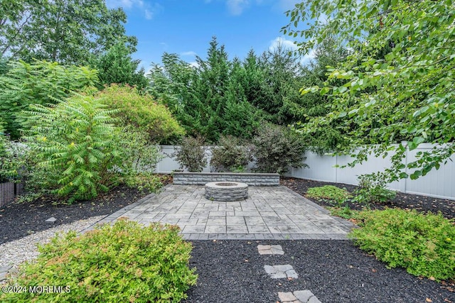 view of patio / terrace with a fire pit