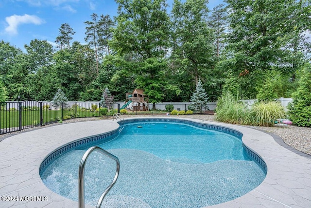 view of pool featuring a playground