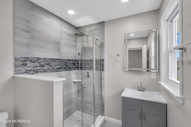 bathroom with vanity and walk in shower