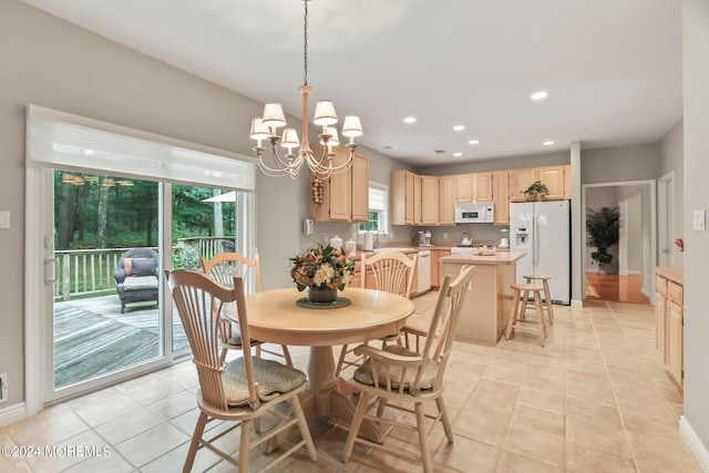 dining space featuring light tile patterned flooring, a notable chandelier, and recessed lighting