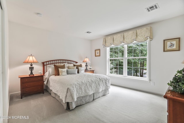 bedroom featuring carpet floors and visible vents