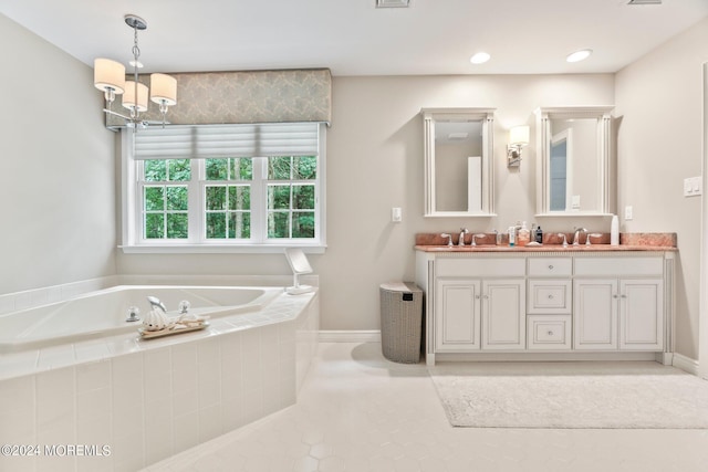 full bathroom featuring double vanity, a sink, a bath, and baseboards