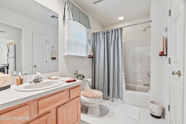 full bathroom with visible vents, toilet, shower / tub combo, vanity, and tile patterned floors