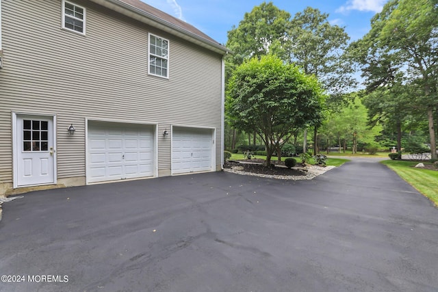 garage featuring driveway