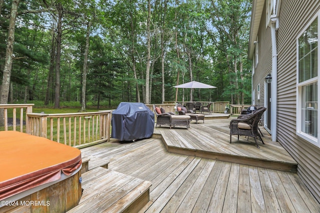 deck featuring an outdoor hot tub, area for grilling, and an outdoor hangout area