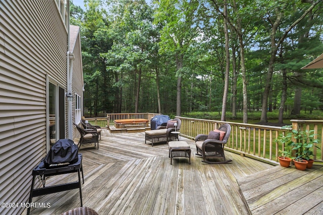 wooden terrace with outdoor lounge area