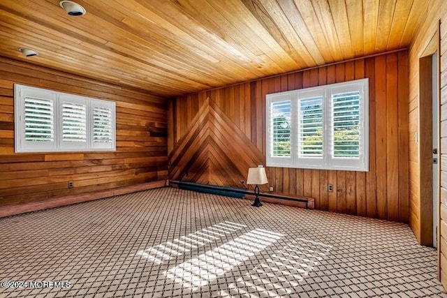 unfurnished room with carpet, wooden ceiling, and wood walls