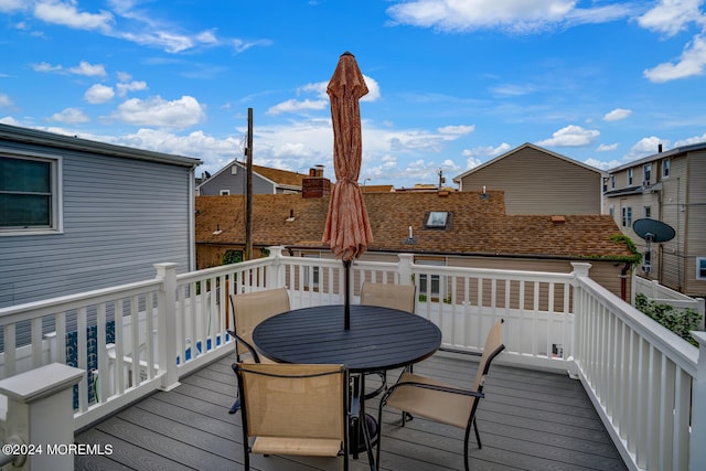 wooden terrace featuring a residential view