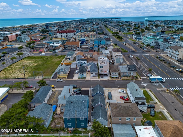 birds eye view of property featuring a water view and a residential view