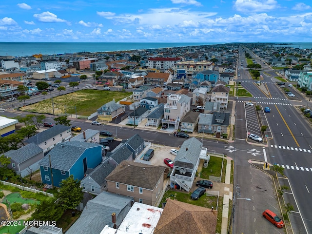 drone / aerial view featuring a water view and a residential view