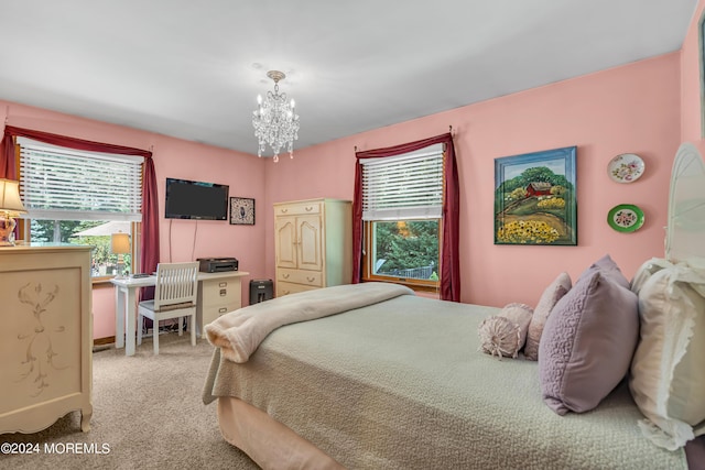 bedroom featuring an inviting chandelier and carpet flooring