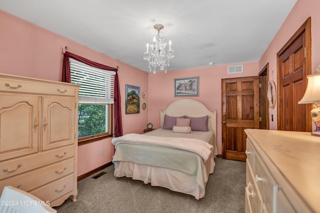 bedroom with carpet flooring and a notable chandelier