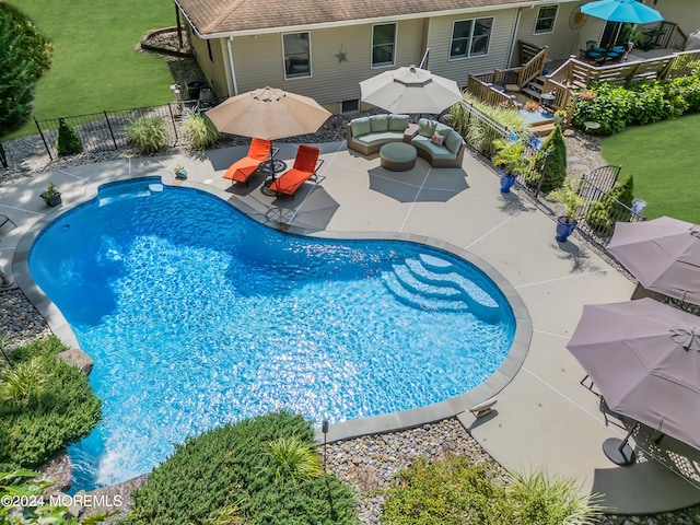 view of pool with a yard and outdoor lounge area