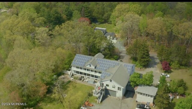 aerial view featuring a wooded view