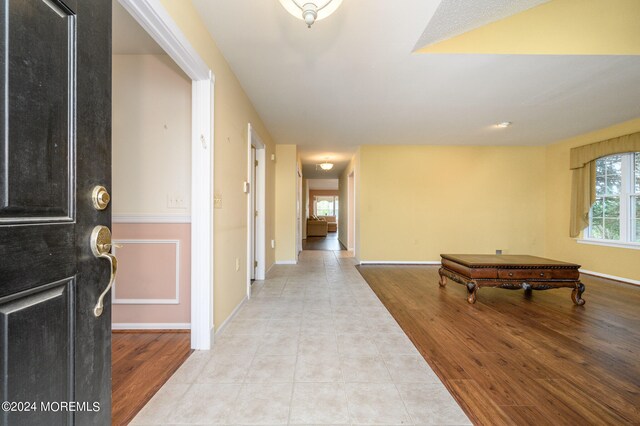 foyer entrance featuring light tile patterned floors