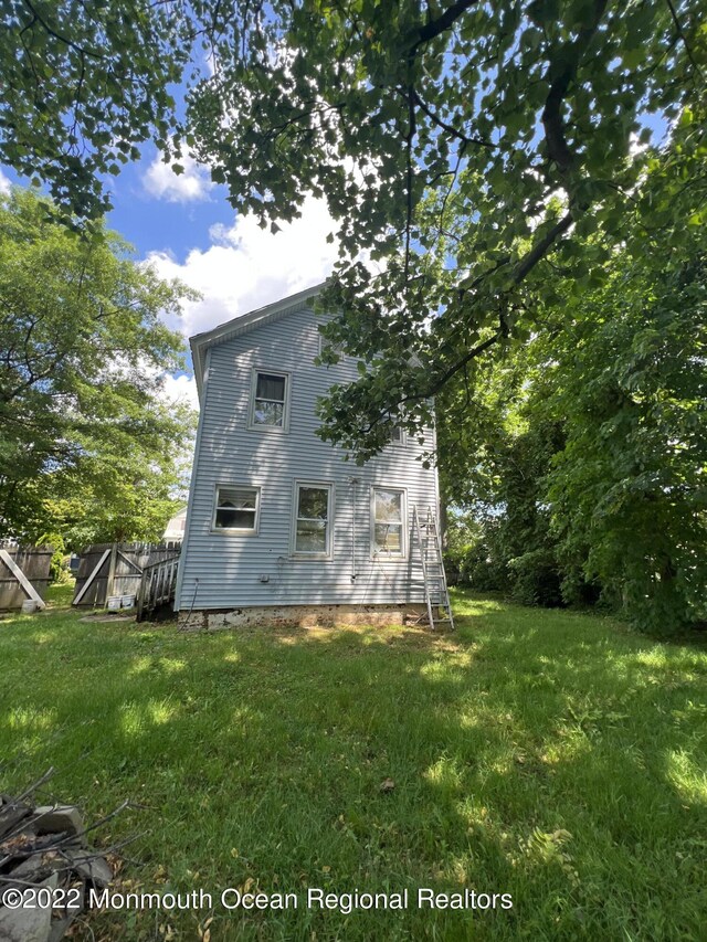 view of home's exterior with a yard