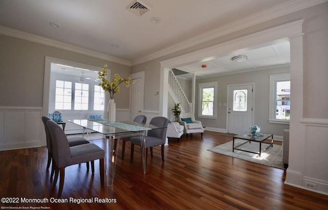 dining room featuring crown molding and dark hardwood / wood-style flooring