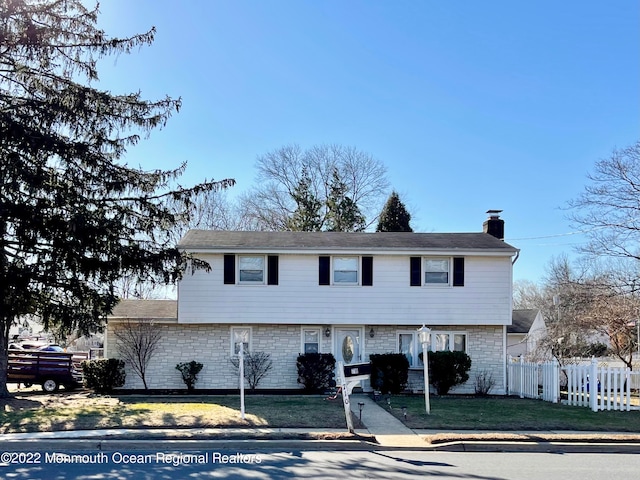 view of front of property with a front lawn