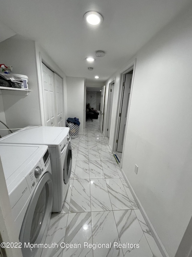 laundry area with washing machine and clothes dryer